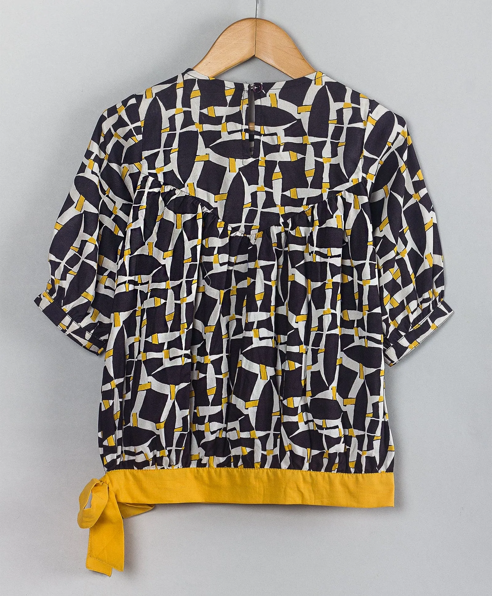 Geometric print top with yellow tie up at waist-Black