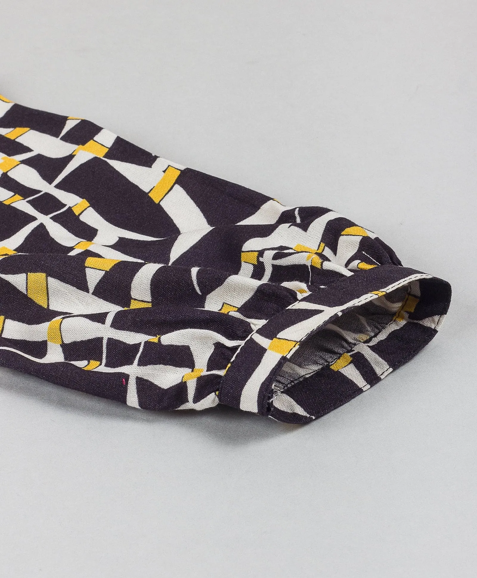 Geometric print top with yellow tie up at waist-Black